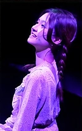 Beaker on stage in purple light