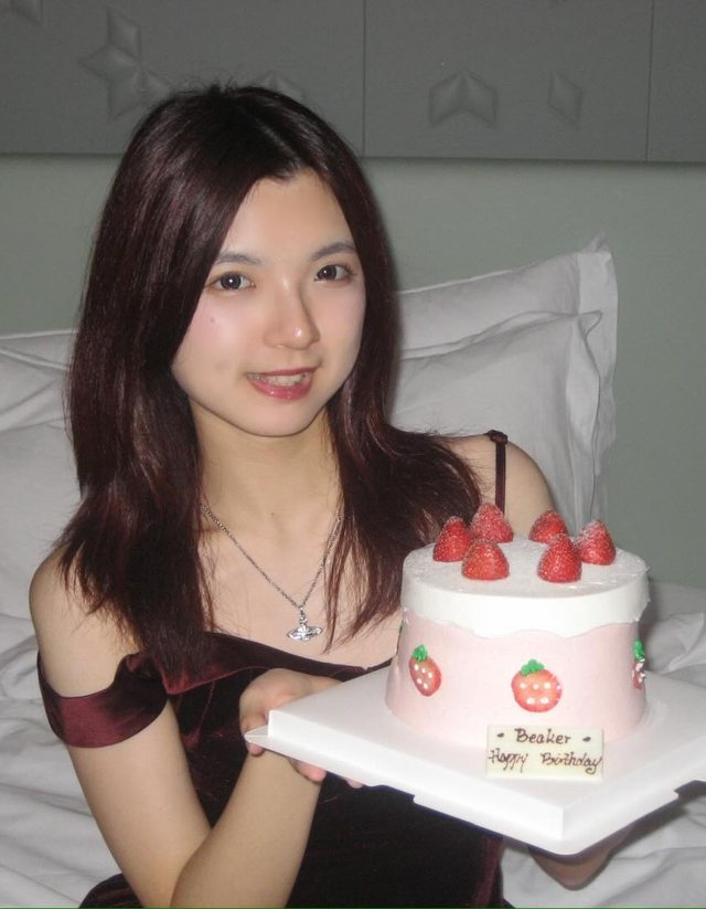 Beaker holding a strawberry birthday cake